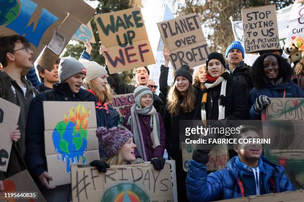 Swedish climate activist Greta Thunberg takes part in a "Friday for future" youth demonstration in a street of Davos on January 24, 2020 on the...