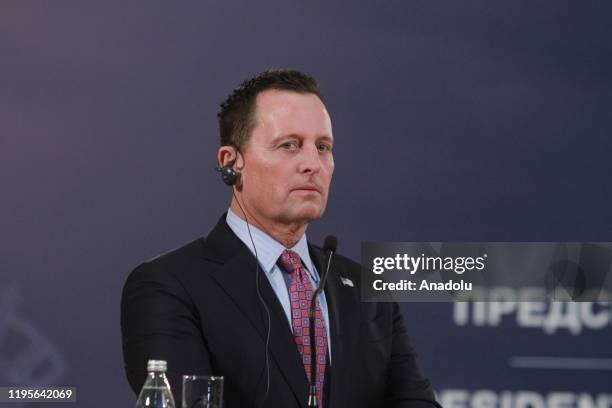 Envoy for the Kosovo-Serbia dialogue, Richard Grenell listens during a joint press conference held with Serbian President Aleksandar Vucic following...