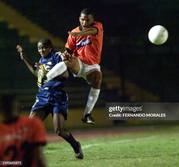 Panamanian soccer player of Tauro, Anel Witlshire , jumps to fight for the ball with Robert Bernardez Honduran player of Motagua, in a game played on...