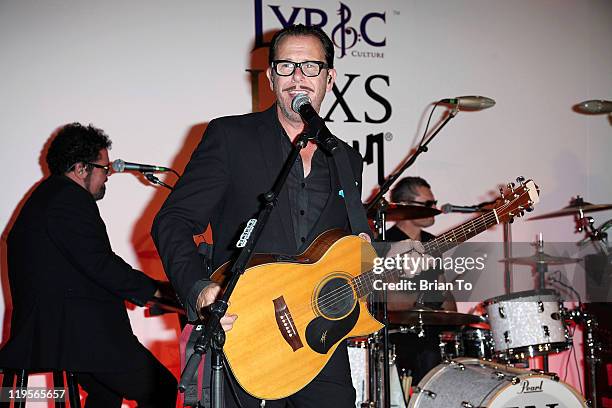 Band members Kirk Pengilly and Andrew Farriss perform at Lyric Culture presents "Electro Sexual" collection with INXS at the Gibson showroom on July...