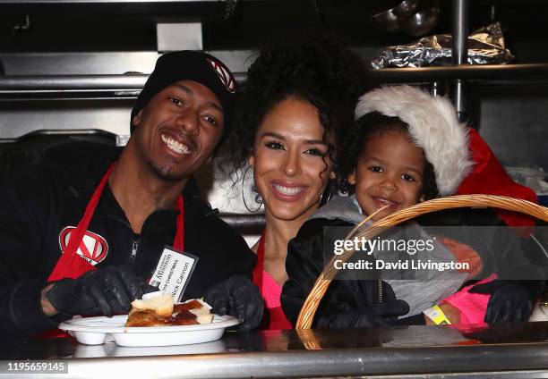 Nick Cannon, Brittany Bell and their son Golden Cannon attend Christmas Celebration On Skid Row at the Los Angeles Mission on December 23, 2019 in...