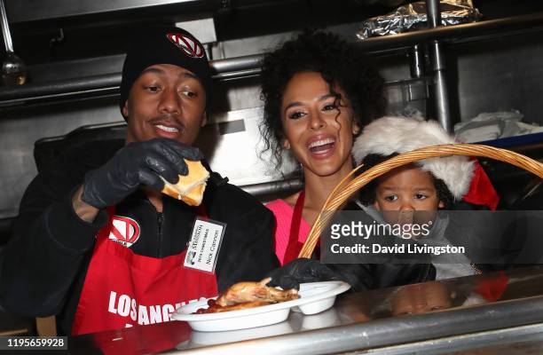 Nick Cannon, Brittany Bell and their son Golden Cannon attend Christmas Celebration On Skid Row at the Los Angeles Mission on December 23, 2019 in...