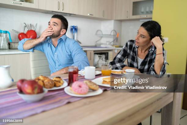 couple having breakfast at home, having relationship problems - husband stock pictures, royalty-free photos & images