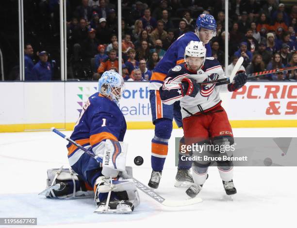 Thomas Greiss of the New York Islanders makes the first period save as Nathan Gerbe of the Columbus Blue Jackets looks for the reboundat NYCB Live's...
