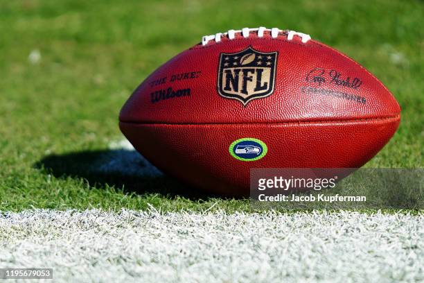Football with the NFL logo and the Seattle Seahawks logo before their game against the Carolina Panthers at Bank of America Stadium on December 15,...
