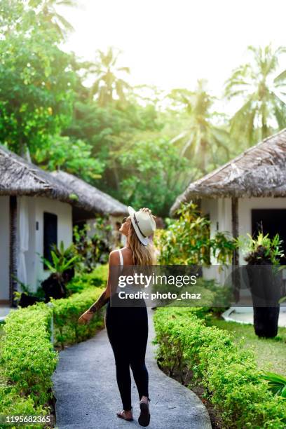 stylish blonde woman enjoying the island views - vanuatu stock pictures, royalty-free photos & images