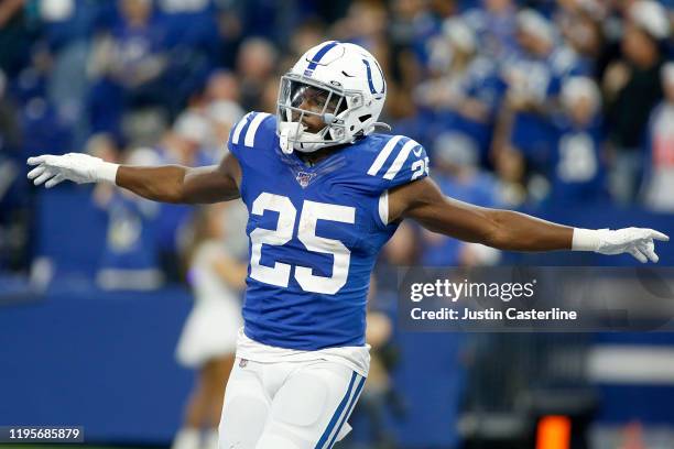 Marlon Mack of the Indianapolis Colts celebrates after a play in the game against the Carolina Panthers at Lucas Oil Stadium on December 22, 2019 in...