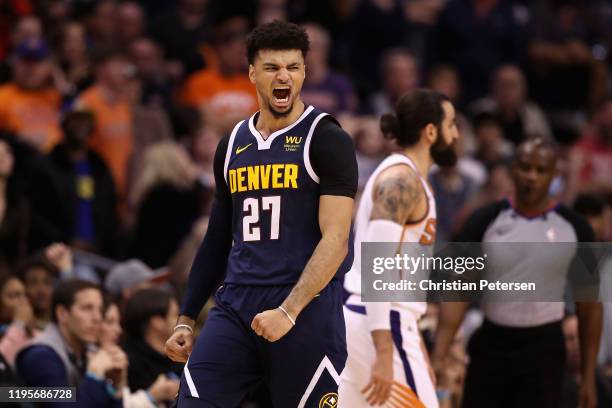 Jamal Murray of the Denver Nuggets celebrates after hitting a three point shot over Ricky Rubio of the Phoenix Suns during the second half of the NBA...
