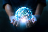Man hands holding blue earth and global networking connection and data exchanges, global communication network concept, Elements of this image furnished by NASA.