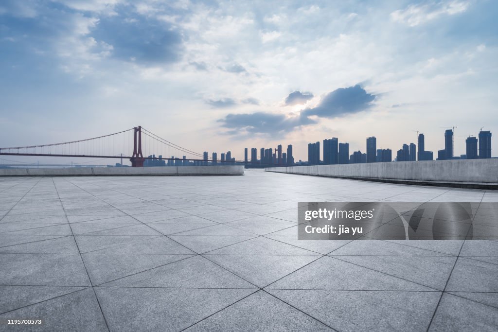 Look at the Wuhan Yangtze River Bridge and the buildings on the other side of the platform. Wuhan City, Hubei Province, China.