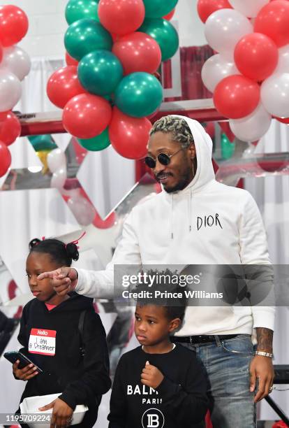 Rapper Future and Future Zahir Wilburn attend Free Wishes Foundation Interactive Winter Wonderland on December 22, 2019 in Atlanta, Georgia.