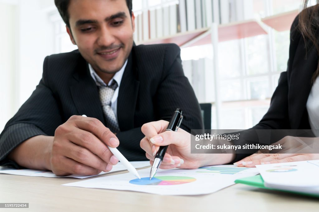 Close-Up Of Business Colleagues Working In Office