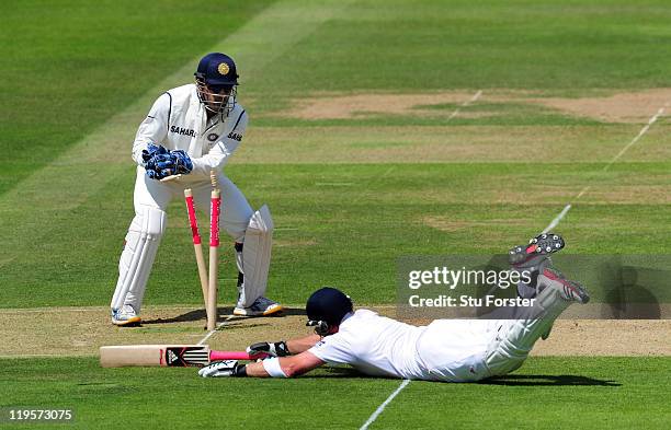 England batsman Ian Bell makes his ground as MS Dhoni of India whips off the bails during day two of the 1st npower test match between England and...