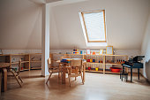 Tables and chairs in modern preschool