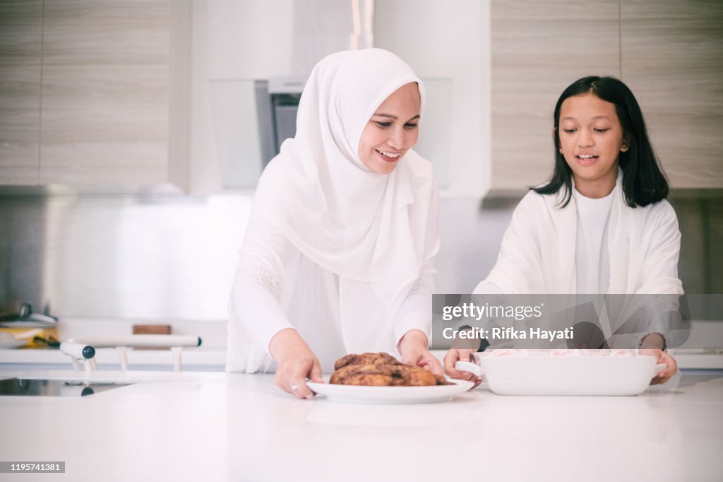 Mother and Daughter Preparing Food For Hari Raya Aidilfitri