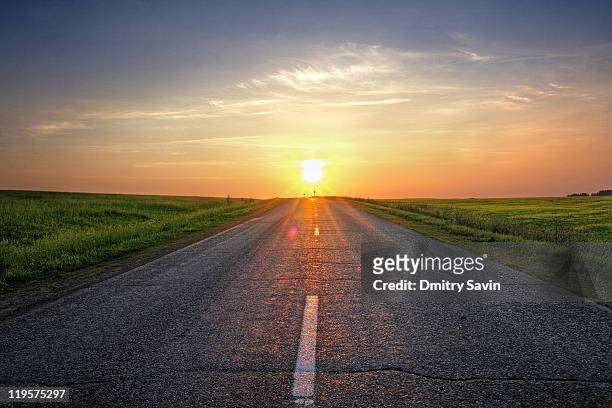 sunlight on road - aurora foto e immagini stock