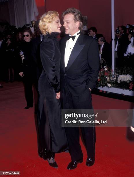 Actress Julia Roberts and actor Kiefer Sutherland attend the 63rd Annual Academy Awards on March 25, 1991 at Shrine Auditorium in Los Angeles,...