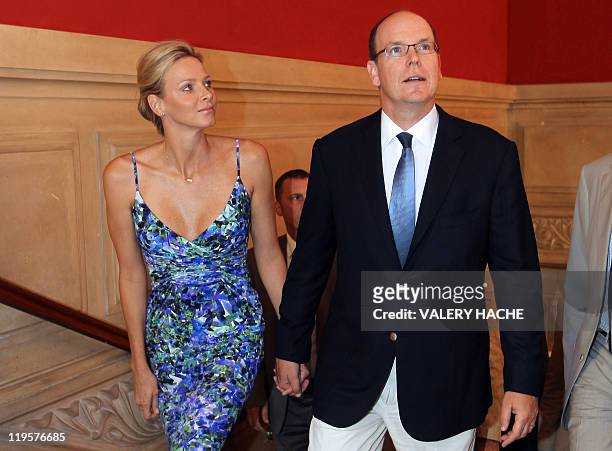 Princess Charlene of Monaco and her husband Prince Albert II of Monaco arrive to visit the exhibition entitled "L'Histoire du Mariage Princier"...
