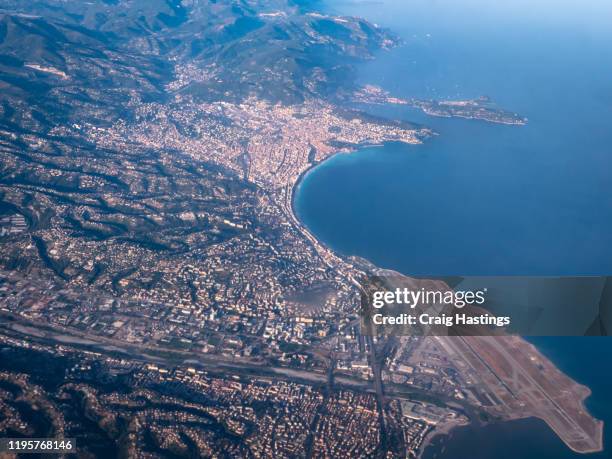 aeroplane aerial view of the city of nice france including the nice côte d'azur airport - cannes aerial stock pictures, royalty-free photos & images