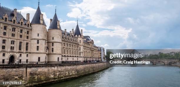 conciergerie in paris france. a gothic, riverside fortress & french revolution prison, housing marie antoinette's former cell. - conciergerie stock pictures, royalty-free photos & images