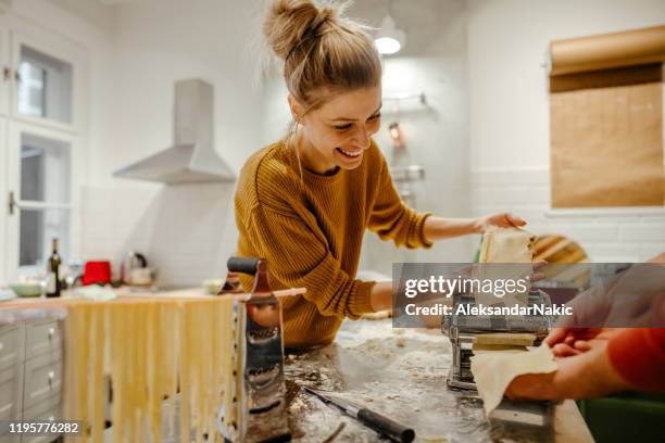 making homemade pasta - pasta making machine stock pictures, royalty-free photos & images