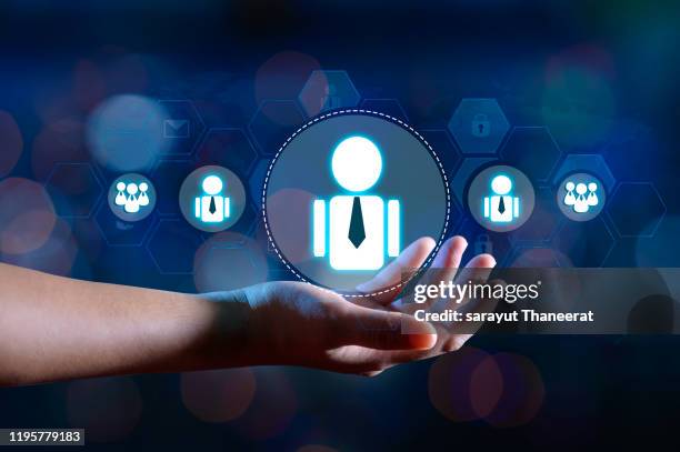 hand businessman human resource management and recruitment business  human resources crm officer looking for employee represented by icon gender discrimination in employees selection. blue background. - choosing insurance stock pictures, royalty-free photos & images