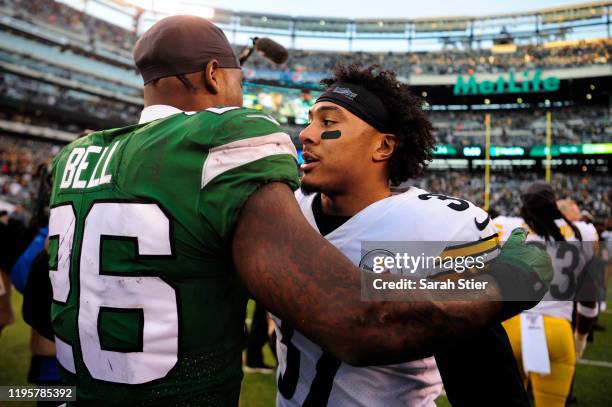 Le'Veon Bell of the New York Jets greets Jordan Dangerfield of the Pittsburgh Steelers after the game at MetLife Stadium on December 22, 2019 in East...