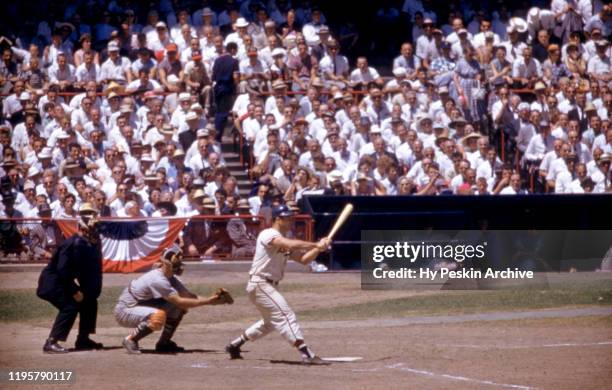 Eddie Mathews of the Milwaukee Braves and National League checks his swing during the 1959 All-Star Game against the American League on July 7, 1959...