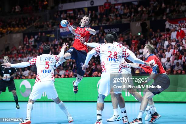 Domagoj Duvnjak; Zeljko Musa from Croatia and Sander Sagosen from Norway during the Men's EHF EURO 2020 semi final match between Norway and Croatia...