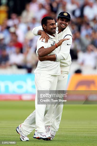 Praveen Kumar of India celebrates the dismissal of Ian Bell of England with teammate Suresh Raina during day two of the 1st npower Test Match between...
