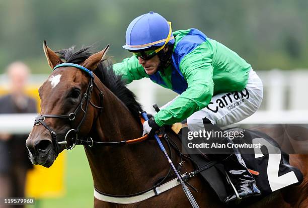 Kieren Fallon riding Caledonian Spring win the Sasco Serviced Apartments EBF Maiden Stakes at Ascot racecourse on July 22, 2011 in Ascot, England.