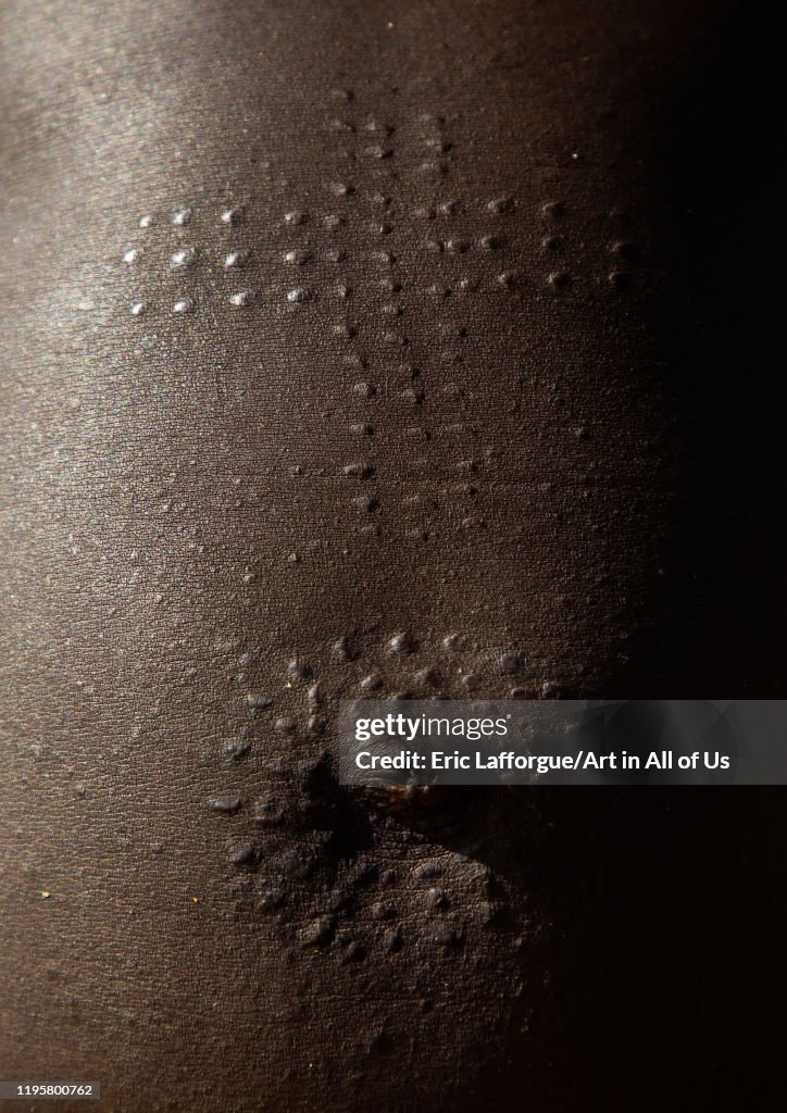 Mundari tribe woman scarifications on the belly in a cross shape, Central Equatoria, Terekeka, South Sudan...