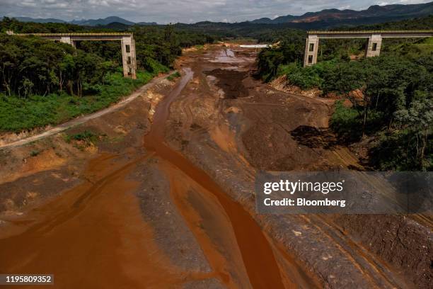 Mud sits below a destoryed Vale SA bridge used to transport iron ore in this aerial photograph taken above Brumadinho, Minas Gerais state, Brazil, on...