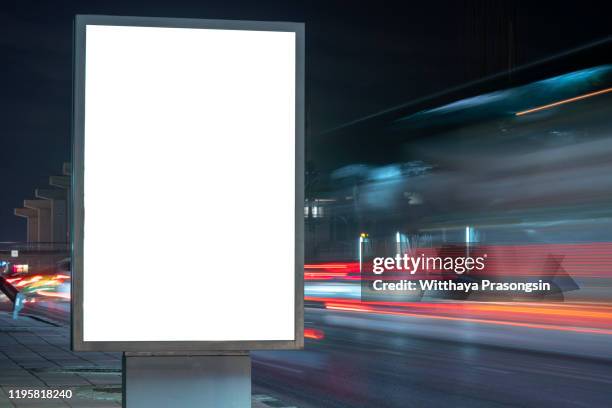 blank billboard on the highway during the twilight with city background with clipping path on screen.- can be used for display your products or promotional - panneau commercial photos et images de collection