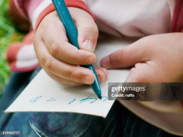 Note Making Child Kids Hand Holding Marker Photos and Premium High Res Pictures - Getty ...