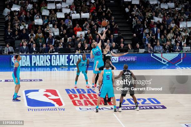 Cody Zeller of the Charlotte Hornets jumps the opening tip against Brook Lopez of the Milwaukee Bucks as part of the NBA Paris Games 2020 on January...