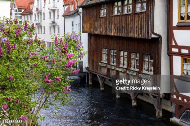 water flowing under german buildings - ricky kresslein stock-fotos und bilder