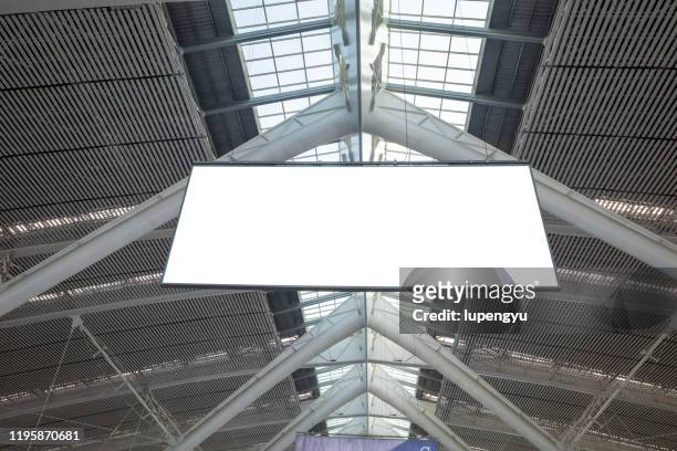 low angle view of blank billboard at station - bill posting stock pictures, royalty-free photos & images