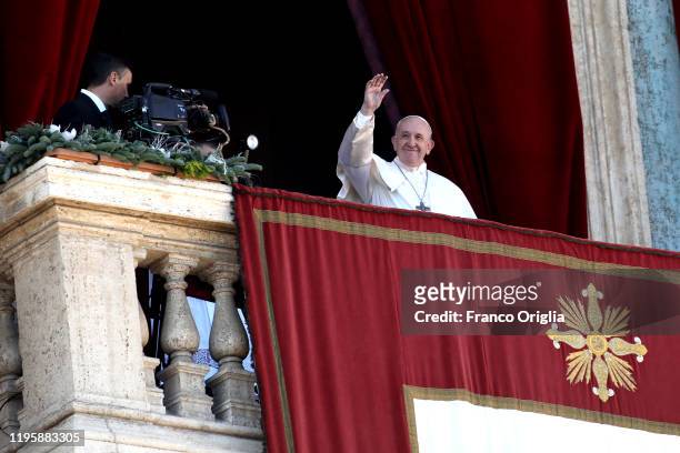 Pope Francis delivers his Christmas 'Urbi et Orbi' blessing message from the central balcony of St Peter's Basilica on December 25, 2019 in Vatican...