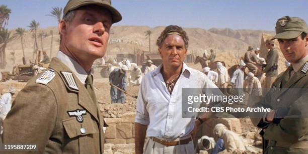 The movie: Indiana Jones and the Raiders of the Lost Ark , , directed by Steven Spielberg. Seen here from left, Wolf Kahler as Dietrich, Paul Freeman...