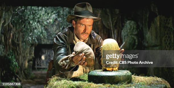 The movie: Indiana Jones and the Raiders of the Lost Ark , , directed by Steven Spielberg. Seen here, Harrison Ford as Indiana Jones. Initial...