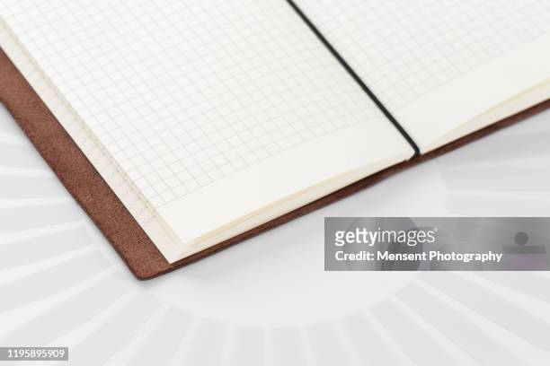 opened blank notepad on gray background - magazine spread stock pictures, royalty-free photos & images