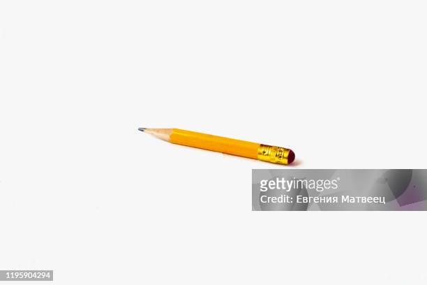used worn pencil with eraser on white background. selective soft focus. text copy space. - pencil with rubber stock pictures, royalty-free photos & images
