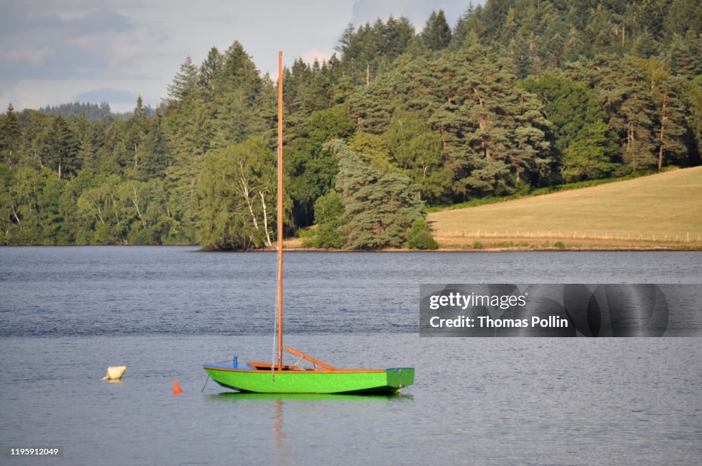 Vassivière lake green single-handed sailing dinghy Optimist