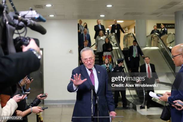 Senate Minority Leader Sen. Chuck Schumer speaks to members of the media during a break of the the Senate impeachment trial against President Donald...