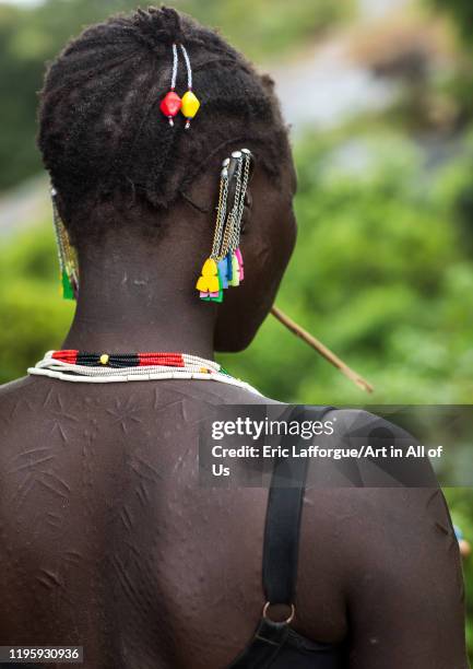 Larim tribe woman scarifications in her back, Boya Mountains, Imatong, South Sudan on November 23, 2019 in Imatong, South Sudan.