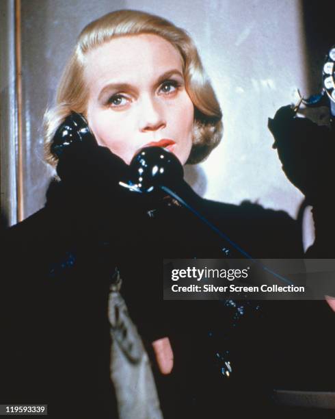 Eva Marie Saint, US actress, wearing a black coat with black gloves while holding a telephone receiver in a publicity image issued for the film,...