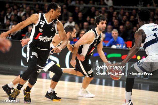 Milos Teodosic and Vincent Hunter of Virtus Segafredo competes with Rok Stipcevic and Henry Sims of Fortitudo Pompea during the LegaBasket italian...