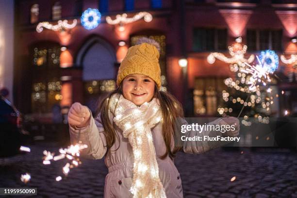 happy girl with sparklers - stralsund stock pictures, royalty-free photos & images