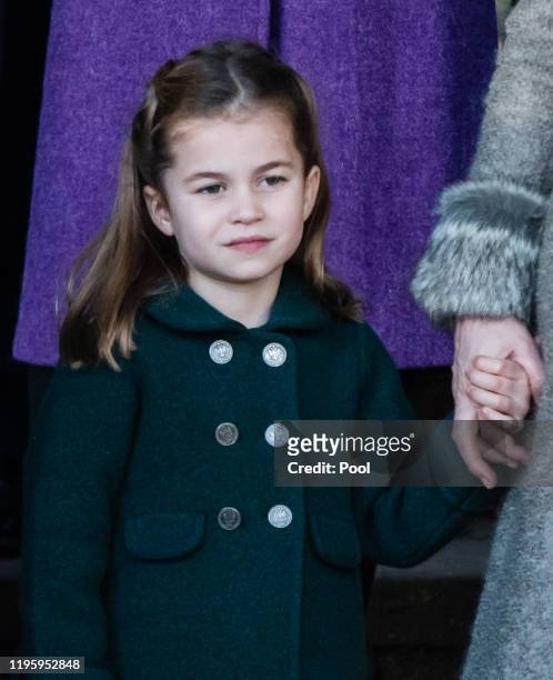 Princess Charlotte of Cambridge is given a hug by a wellwisher as she attends the Christmas Day Church service at Church of St Mary Magdalene on the...